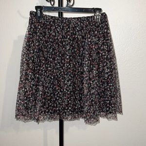 Black with pink, yellow and white pattern knee length skirt, size Small